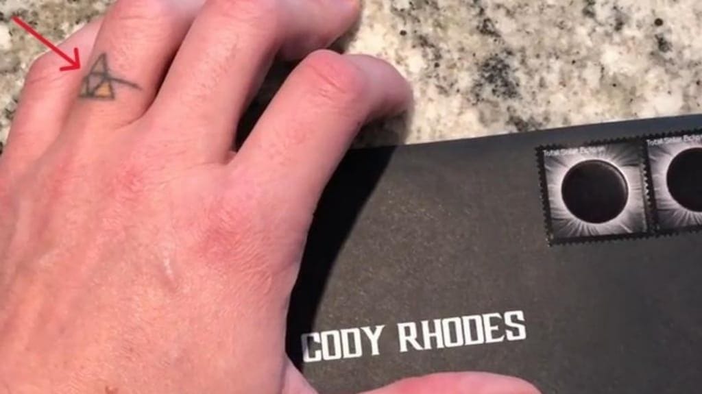 Cody Rhodes geometric family tattoo on left ring finger