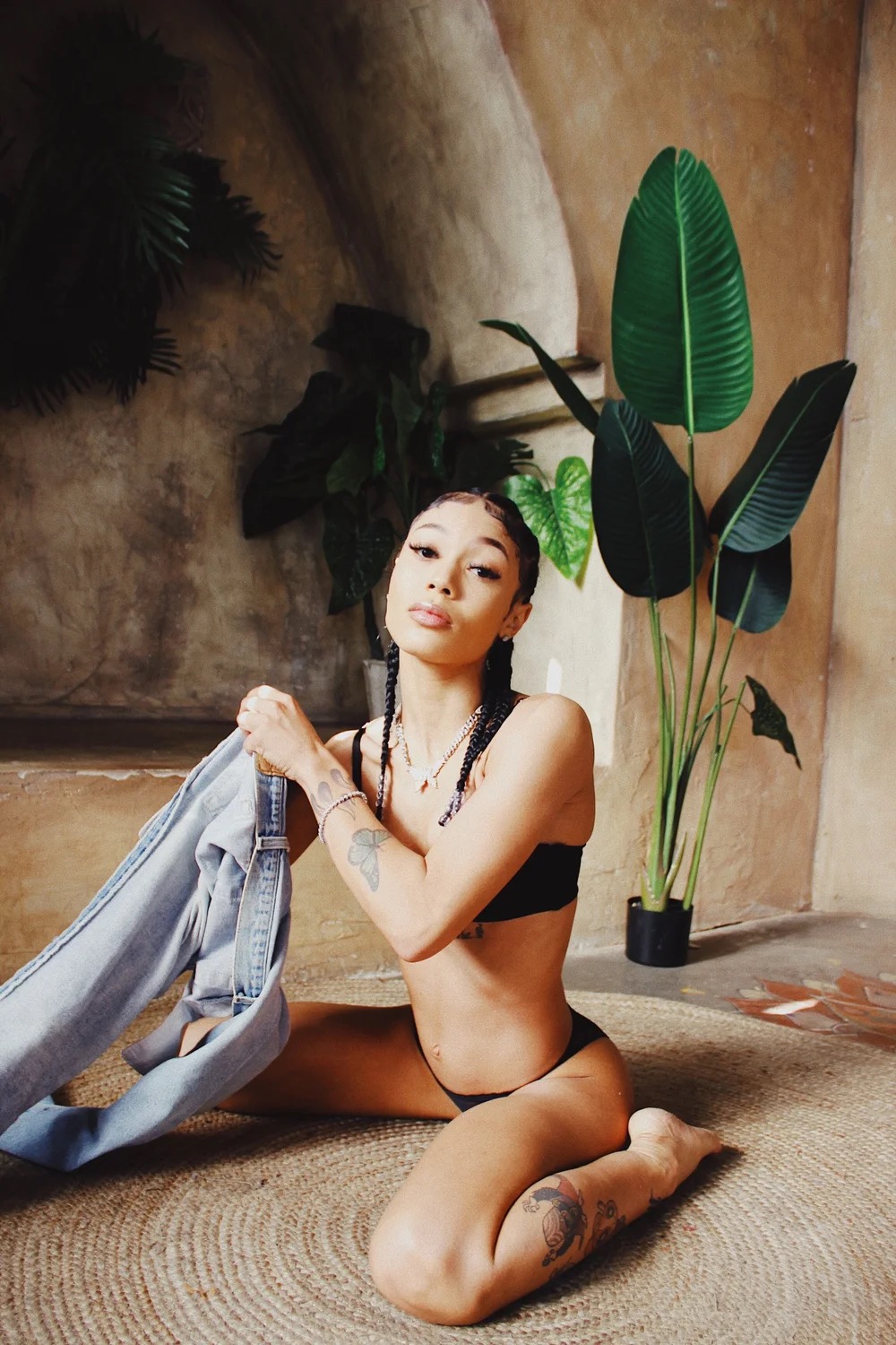 Coi Leray face-visible and leg tattoos