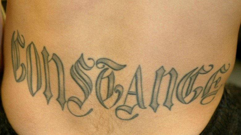 Dave Navarro showing Constance lettering on his lower back