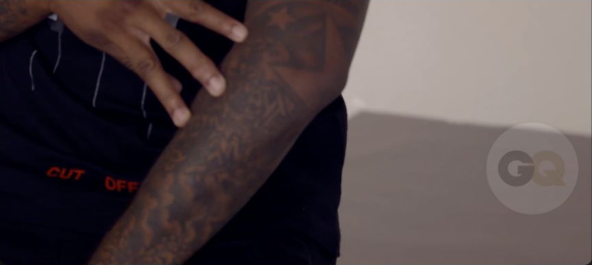DeMarcus Cousins showing Product of My Environment graffiti lettering