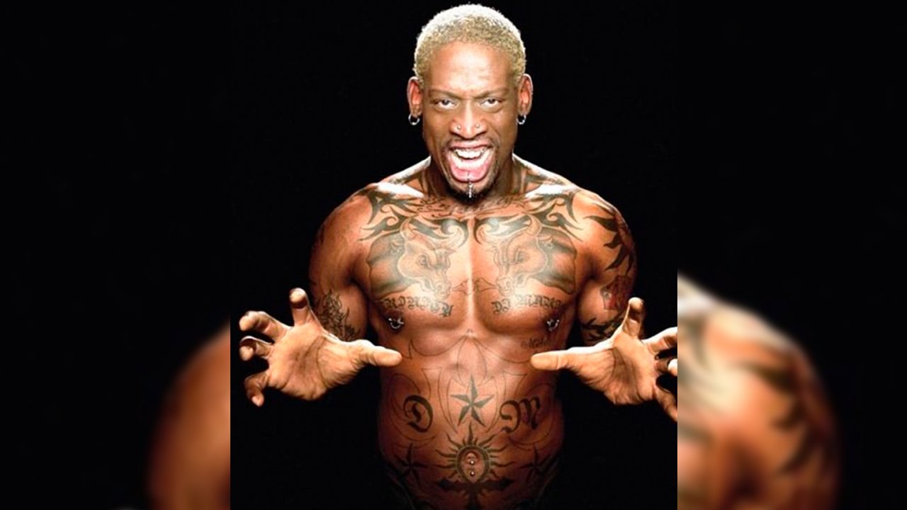 Dennis Rodman showing the paired bull chest tattoos