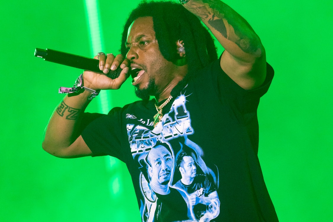 Denzel Curry arm tattoos during performance