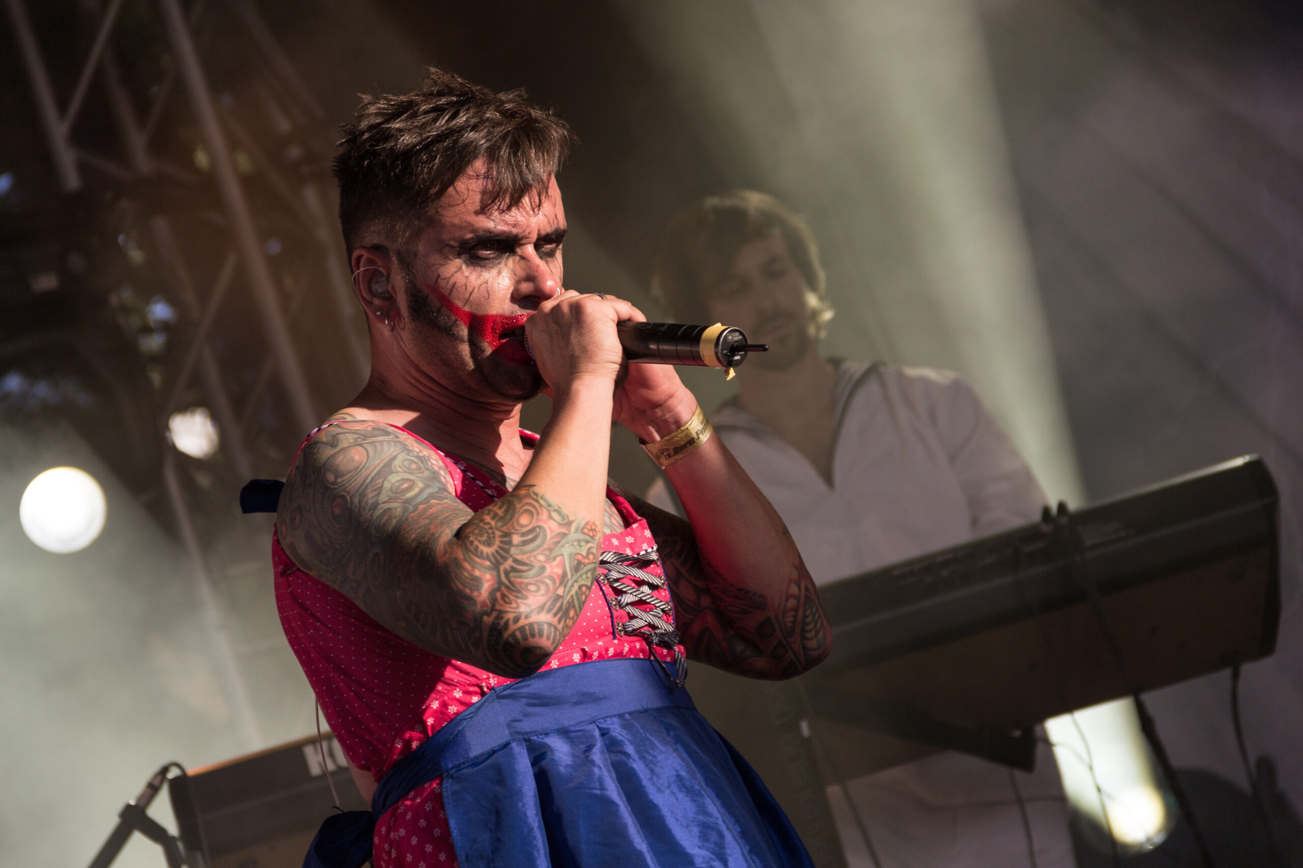 Dero Goi left arm tattoo detail in a high-resolution live photograph.