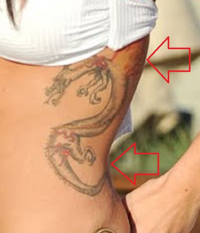 JWoww dragon rib tattoo