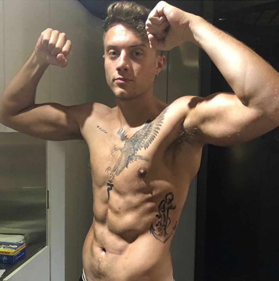 Roman Kemp eagle chest tattoo and anchor with lizard on his ribs