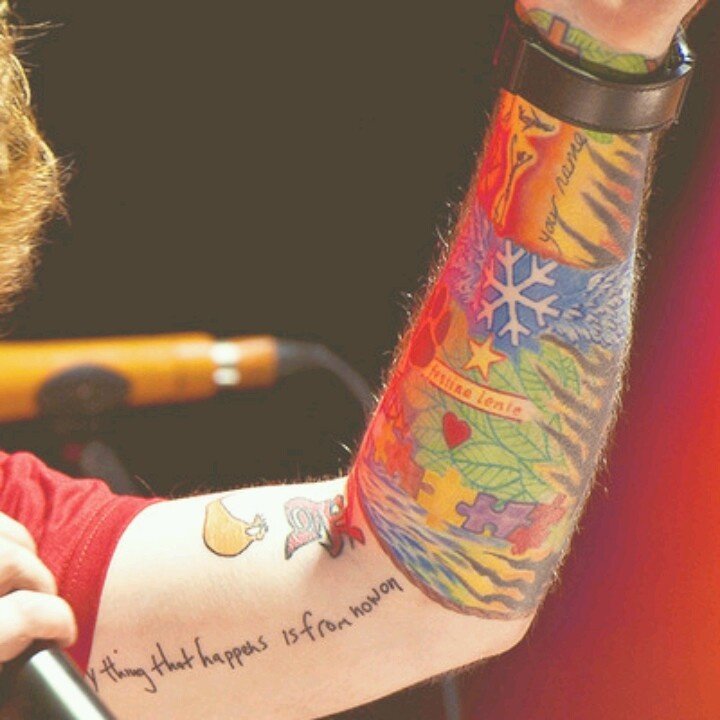 Ed Sheeran showing the Everything that happens is from now on lyric tattoo