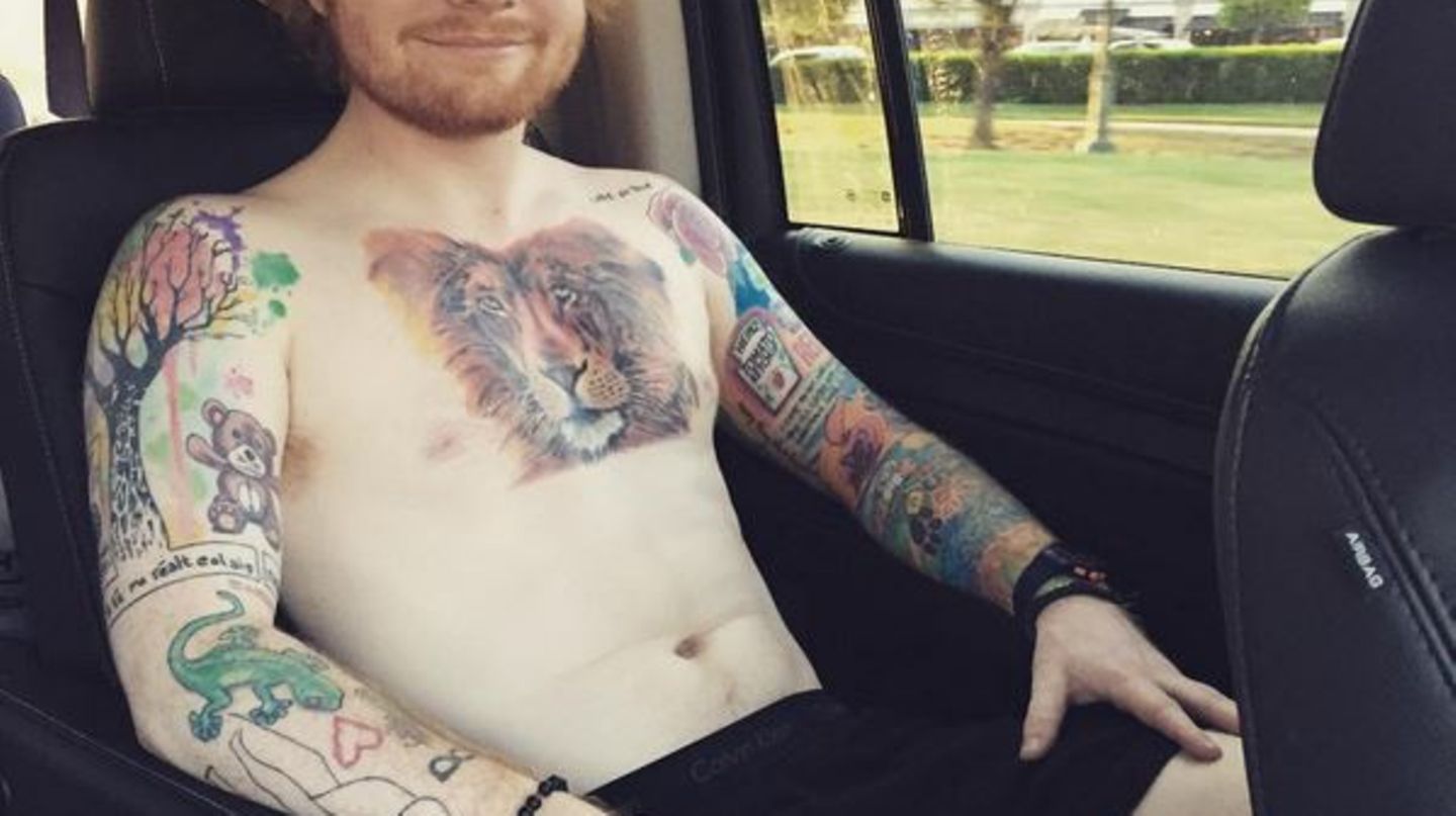 Ed Sheeran showing his tattoo collection