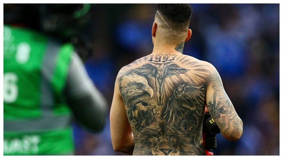 Ederson Moraes back tattoo with lion eagle and cross