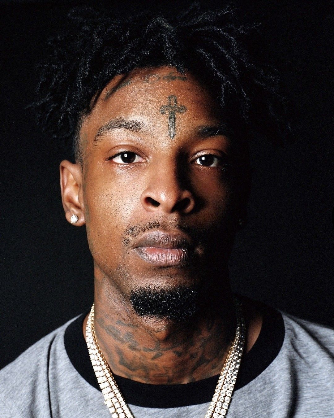 21 Savage close-up showing the dagger and other face tattoos