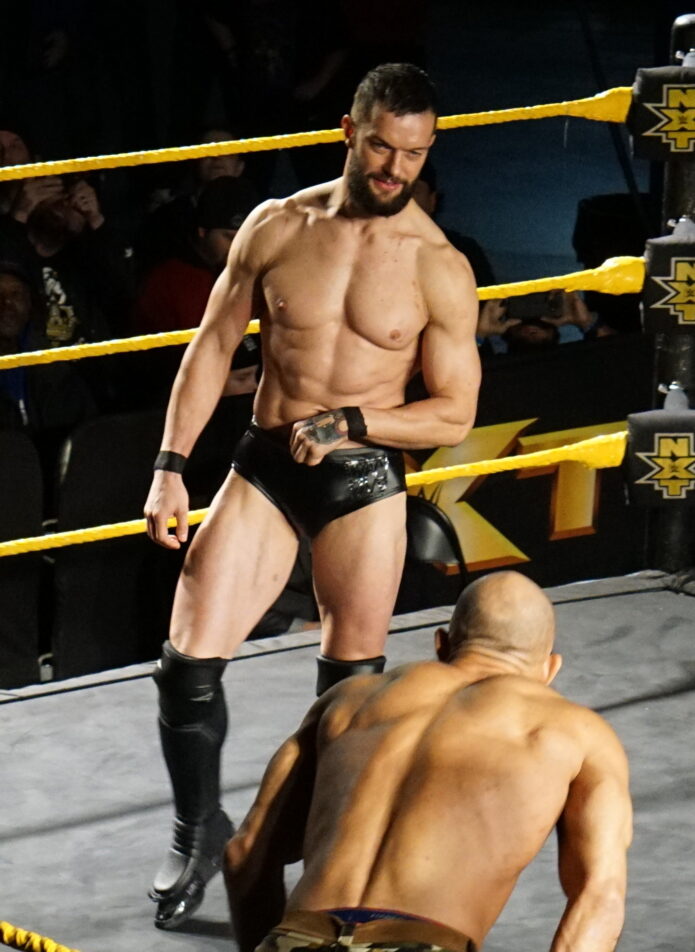 Finn Bálor standing in the wrestling ring at an NXT live show