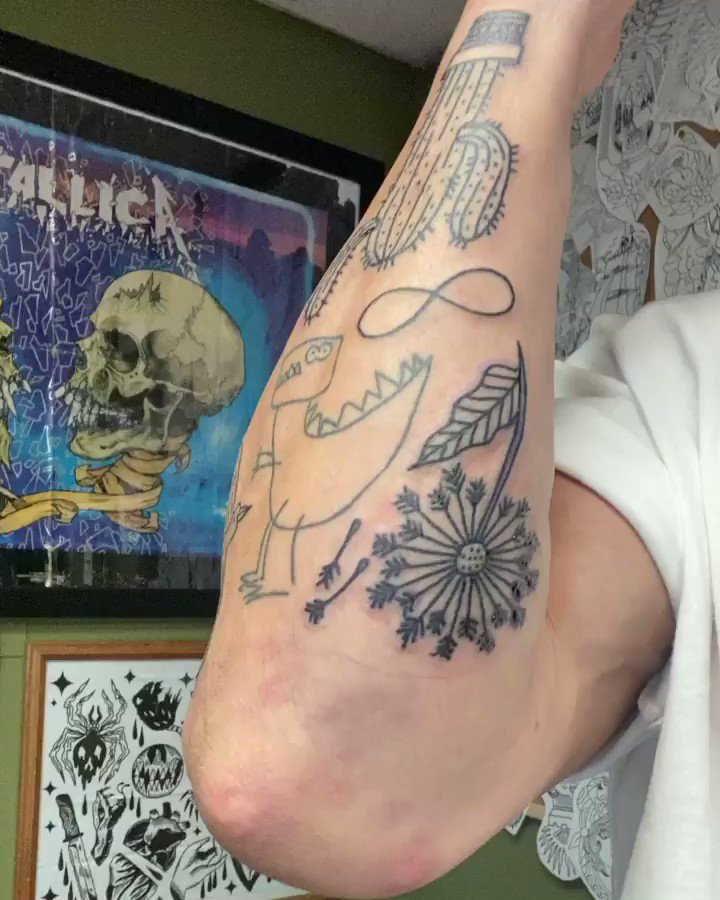 Finn Bálor’s forearm tattoos: dinosaur, dandelion, cactus and seagull