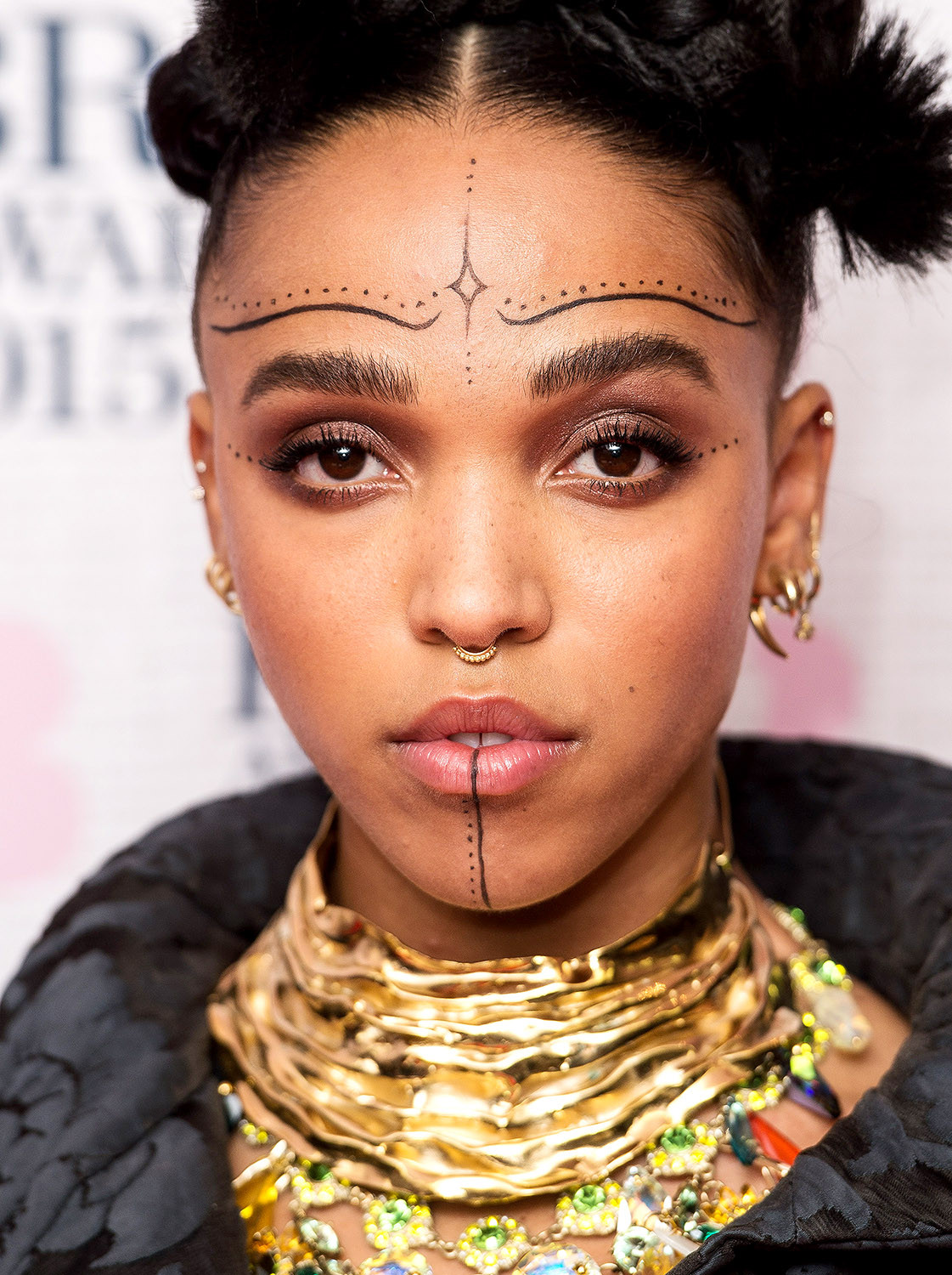 FKA twigs temporary face tattoos