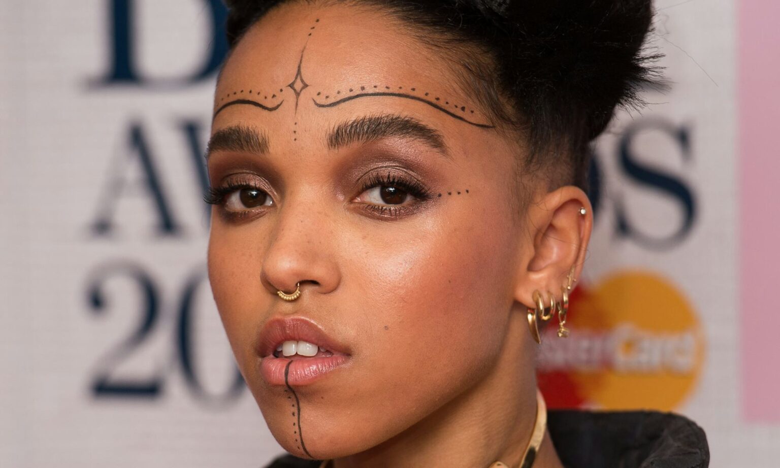 FKA twigs temporary face tattoos