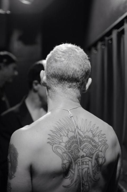 Flea’s large radiating design across his upper back