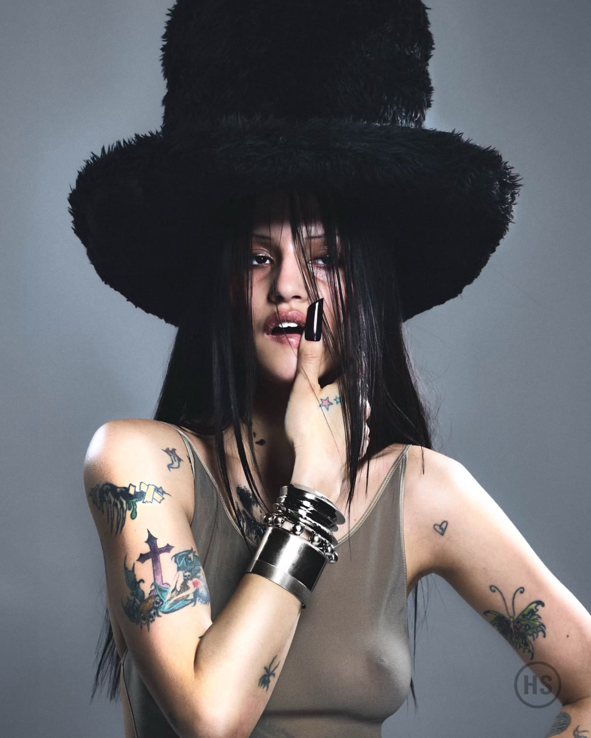 Gabbriette Bechtel with colorful arm and hand tattoos