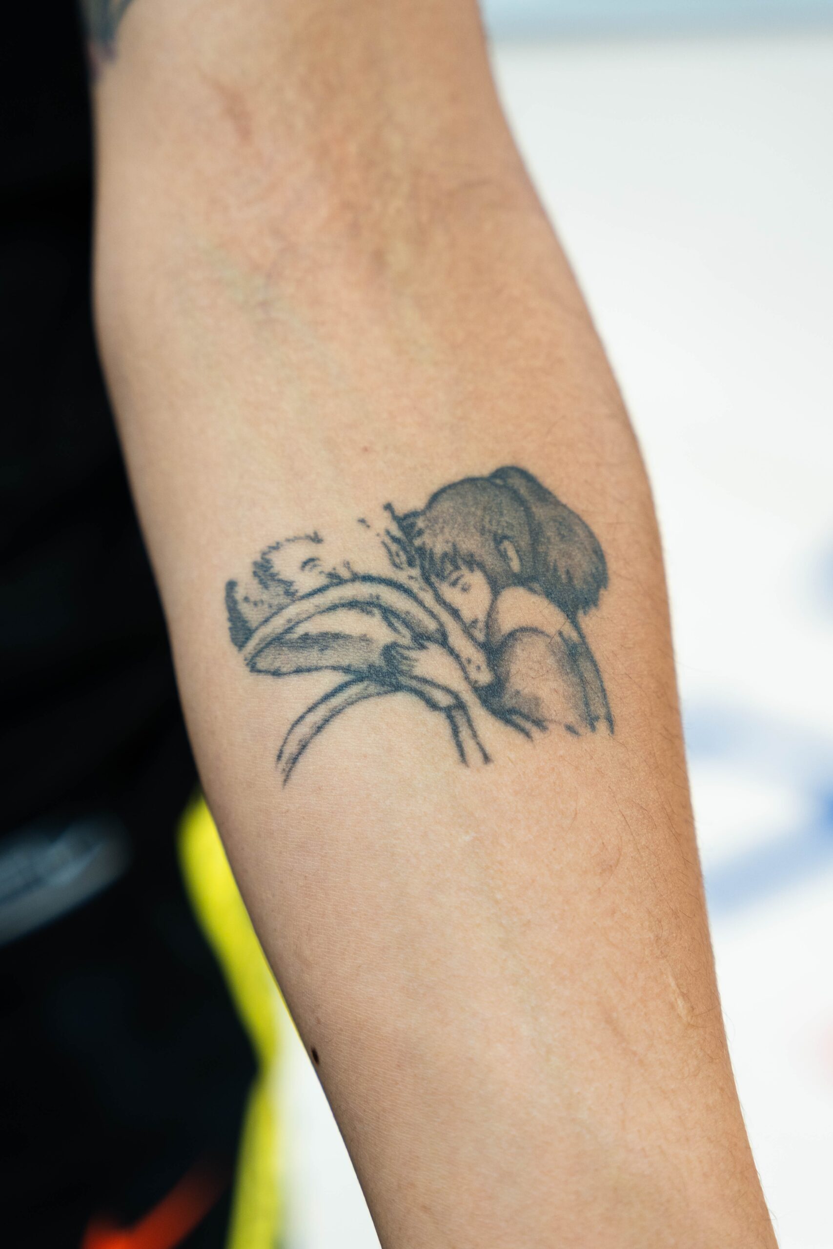 Gabby Williams family flower and triangle tattoo