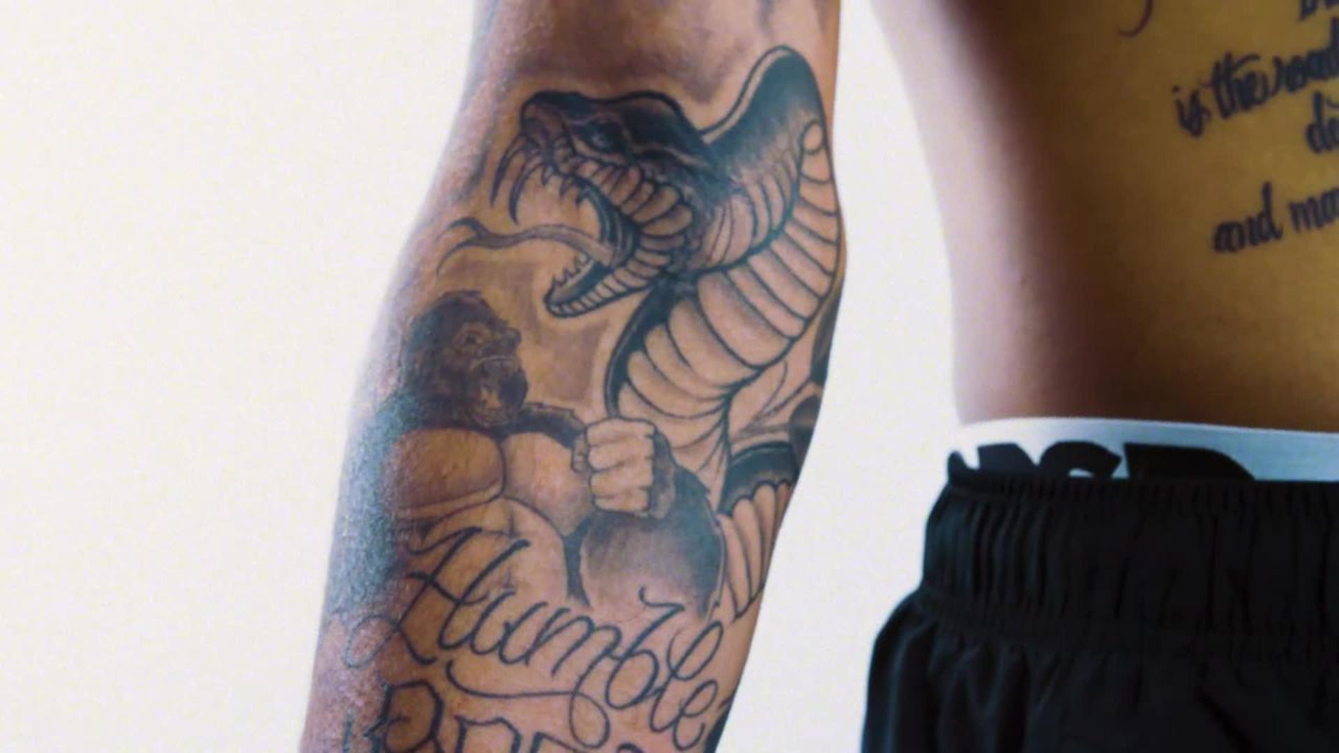 Kyle Kuzma gorilla and snake forearm tattoo with Humble lettering