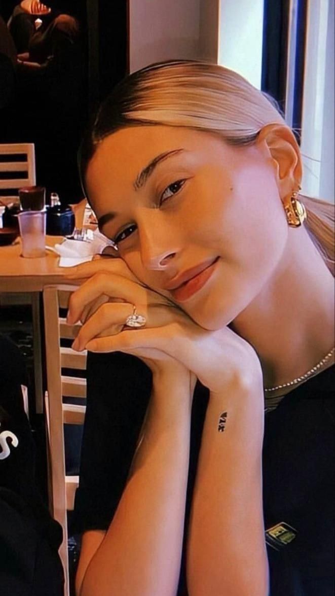 Hailey Bieber Roman numeral wrist tattoo