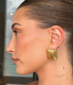 Hailey Bieber’s tiny tattoos keep family dates close to the skin