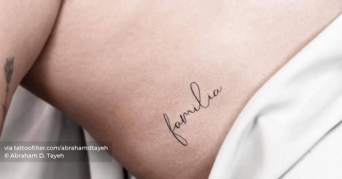 J Balvin showing the Familia rib tattoo
