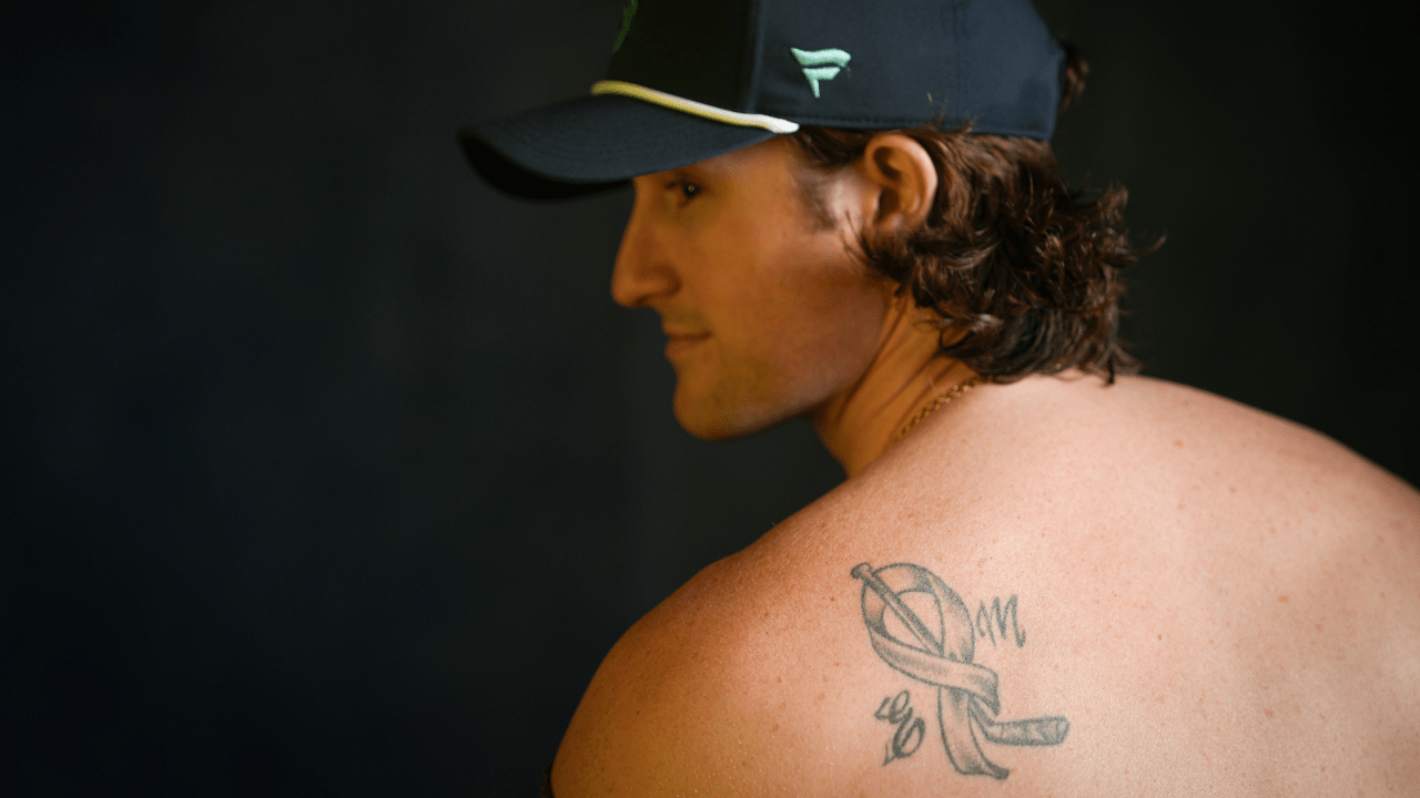 Jared McCann shoulder ribbon tattoo