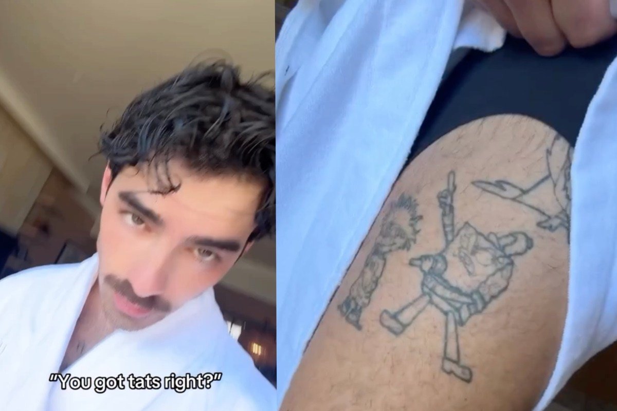 Joe Jonas showing his forearm symbol tattoo