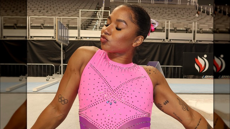 Jordan Chiles Patience hand and Olympic rings tattoos