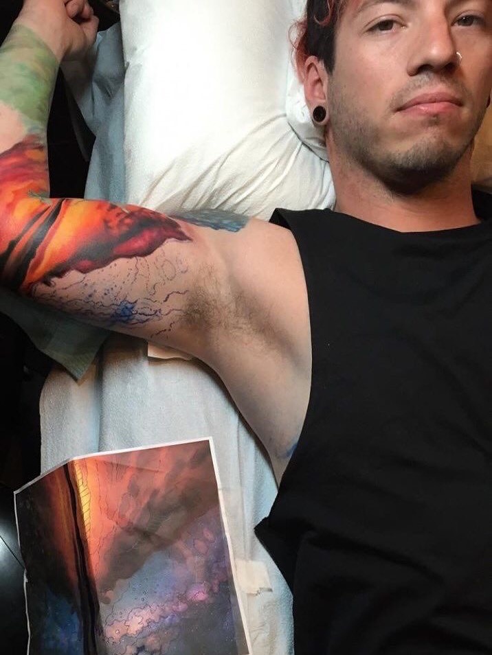 Josh Dun colorful arm tattoos close-up