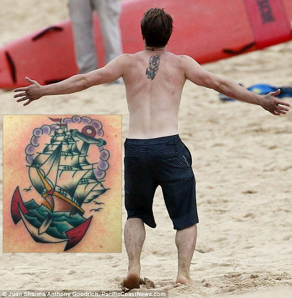 Josh Hutcherson ship sailing into a sunset back tattoo