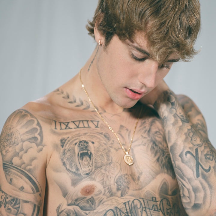 Justin Bieber’s tattooed chest and arms