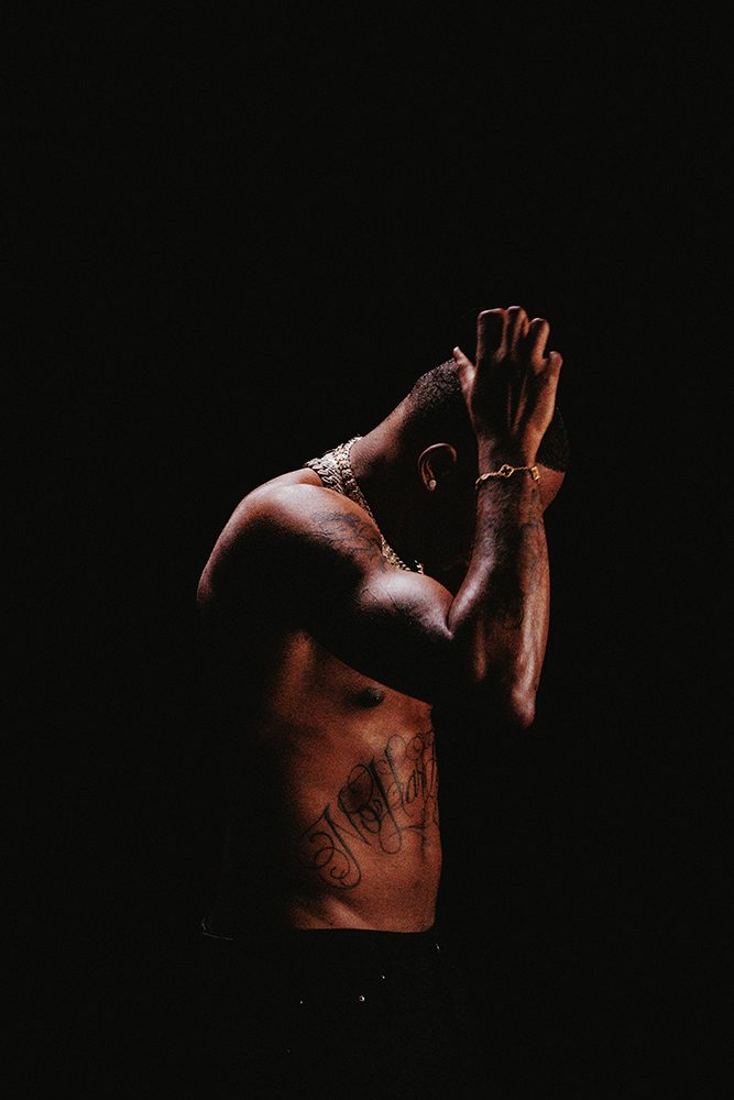 Kalan.FrFr No Hard Feelings abdominal tattoo and forearm tattoos