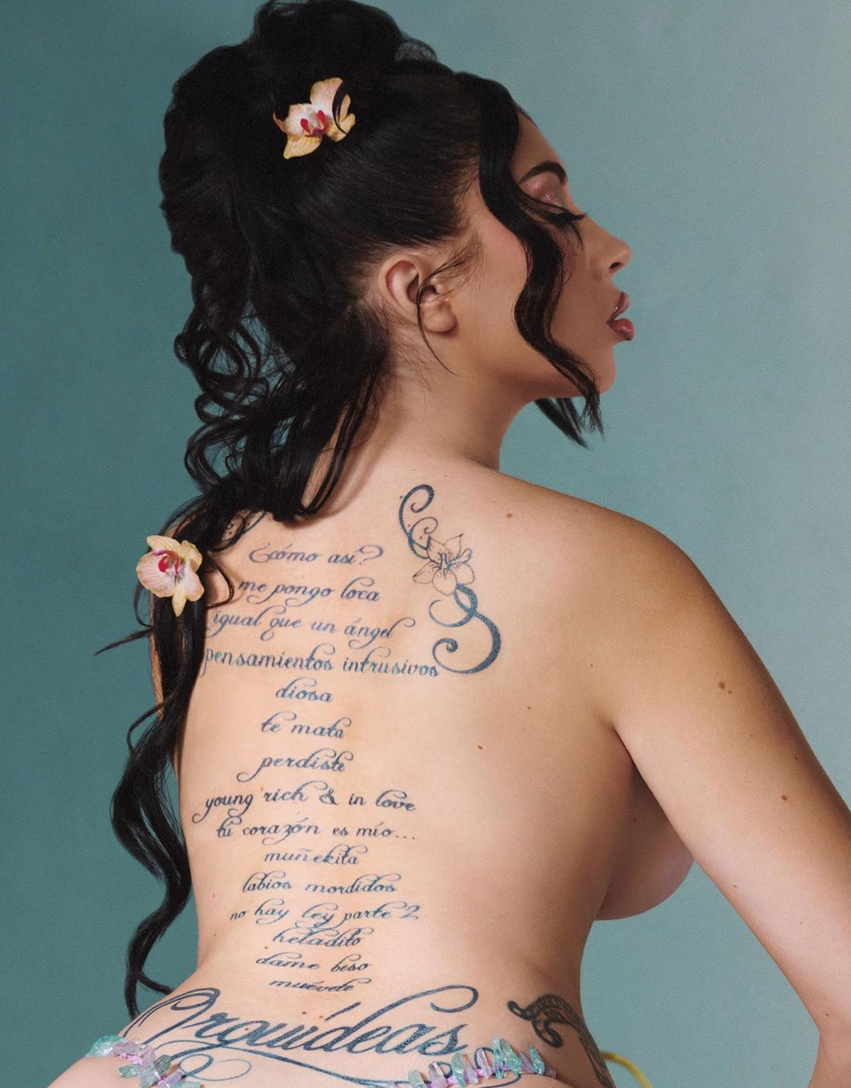 Kali Uchis music-related back tattoo and tracklist design