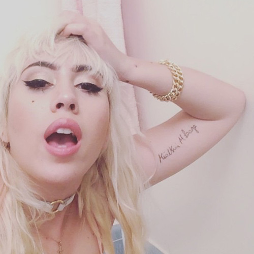 Kali Uchis father passport signature tattoo on her bicep