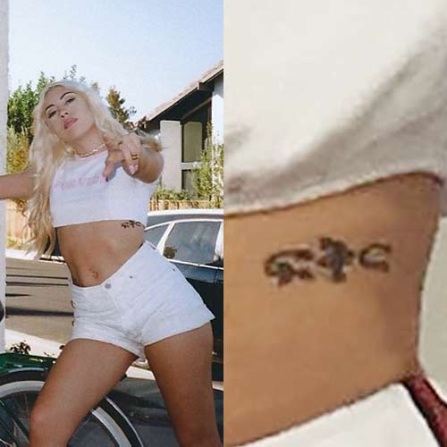 Kali Uchis initials tattoo on her side