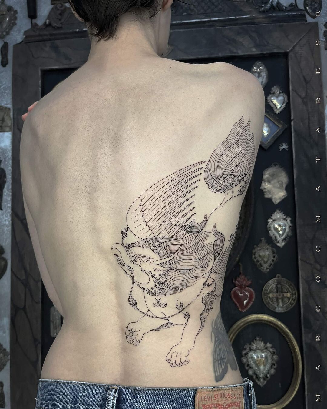 Kasia Smutniak winged lion tattoo across the shoulder and back