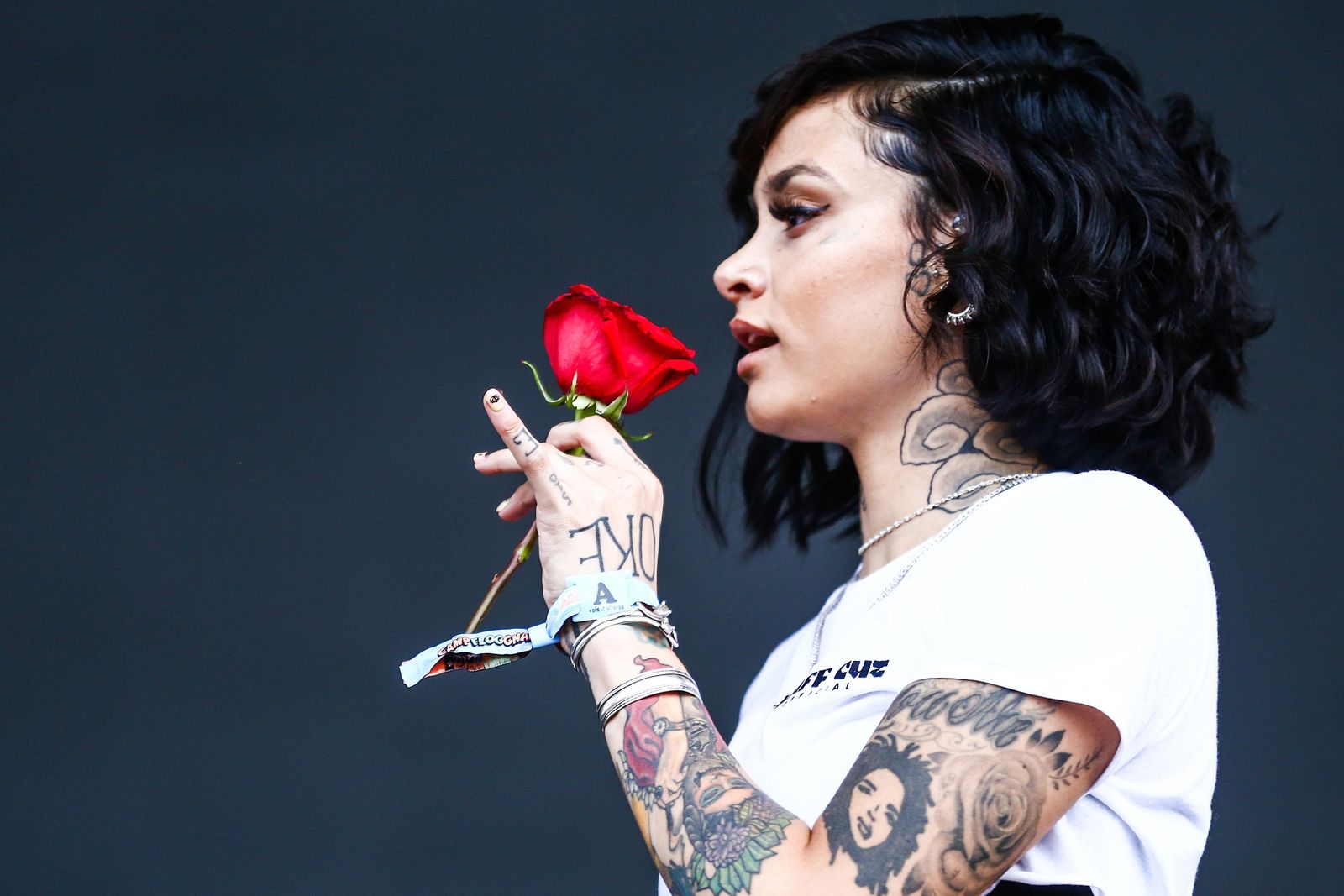 Kehlani tattooed arm showing the family-tattoo context