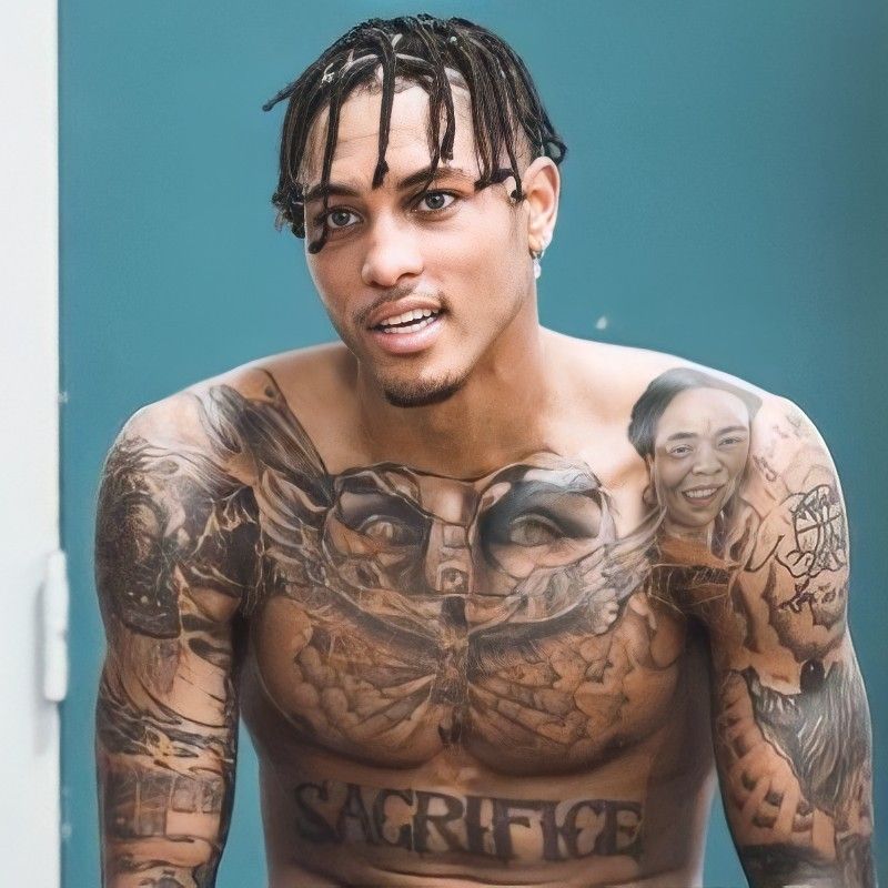 Kelly Oubre Jr chest owl tattoo