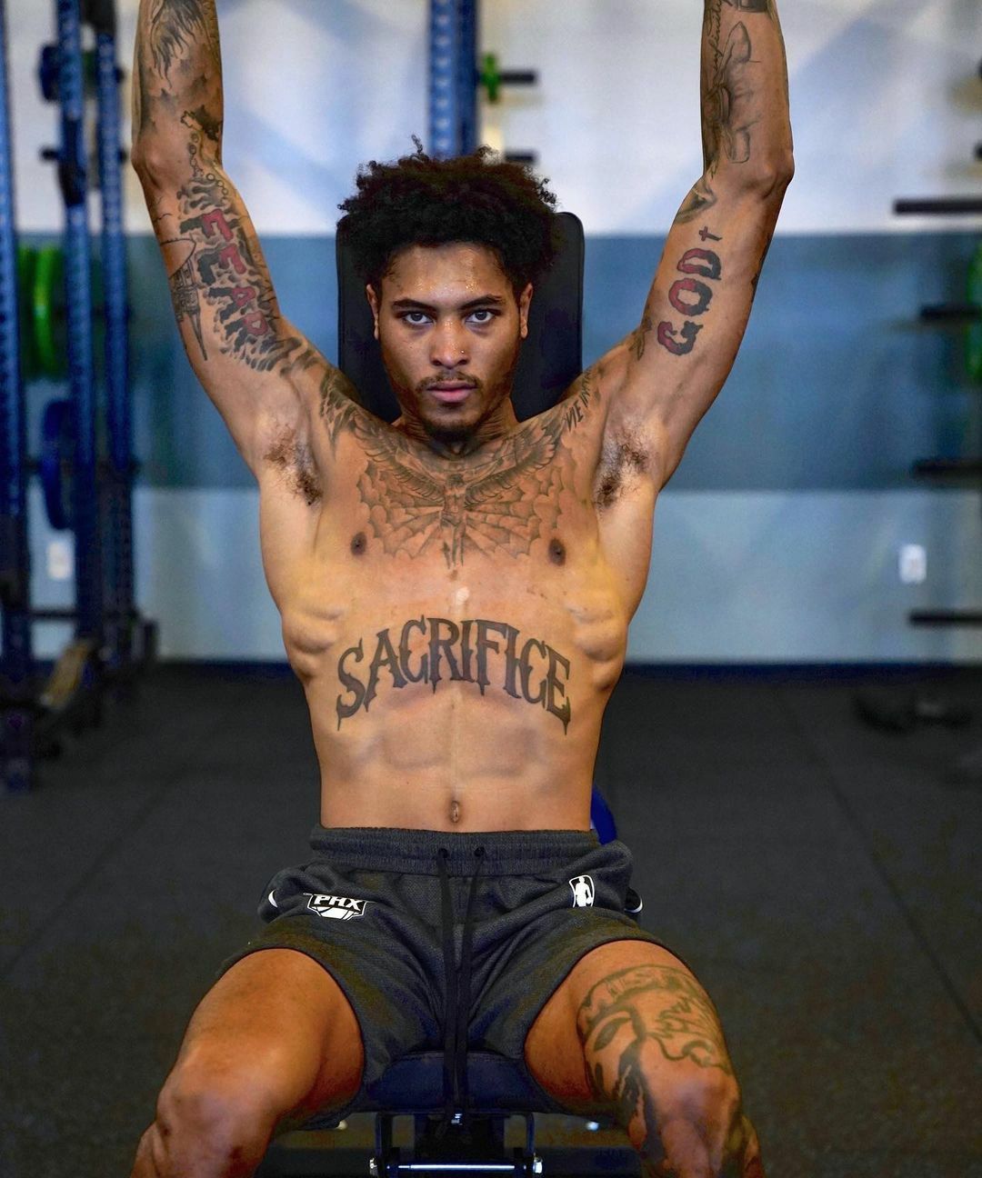 Kelly Oubre Jr God bicep tattoo
