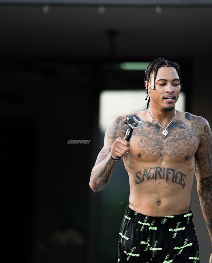 Kelly Oubre Jr outdoor sacrifice tattoo