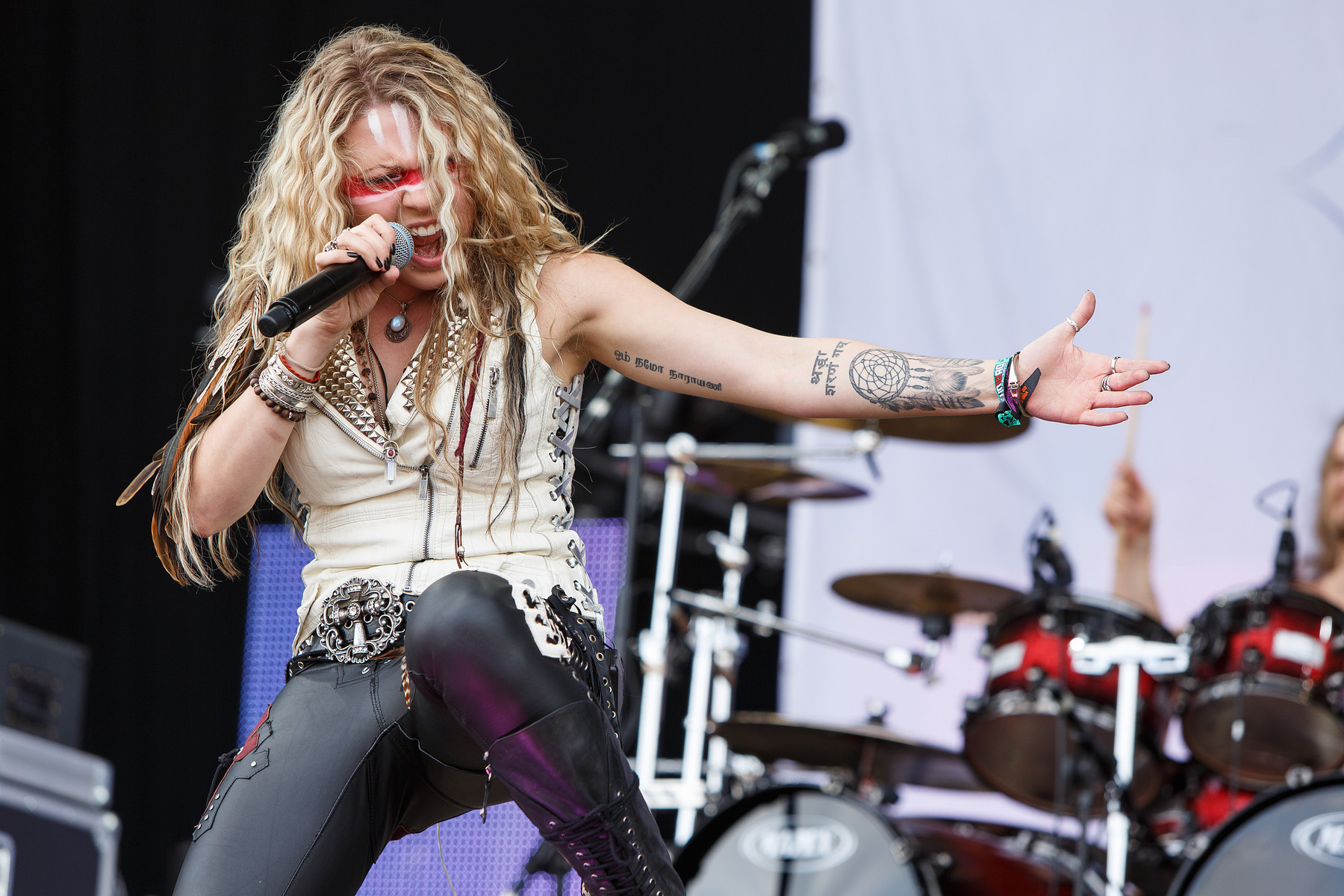 Kobra Paige dreamcatcher and script forearm tattoos