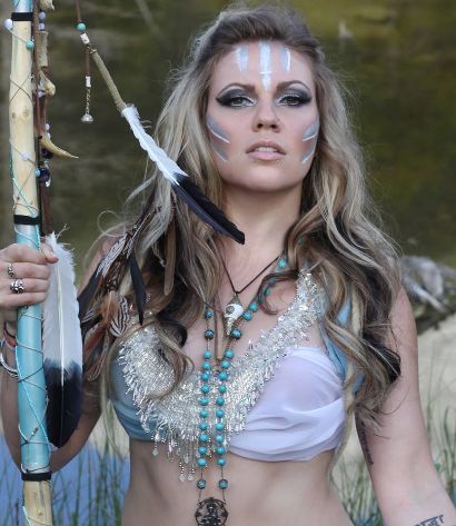 Kobra Paige lower torso tattoo visible in portrait