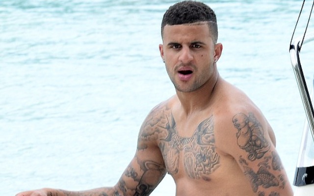 Kyle Walker chest and arm tattoos on a boat
