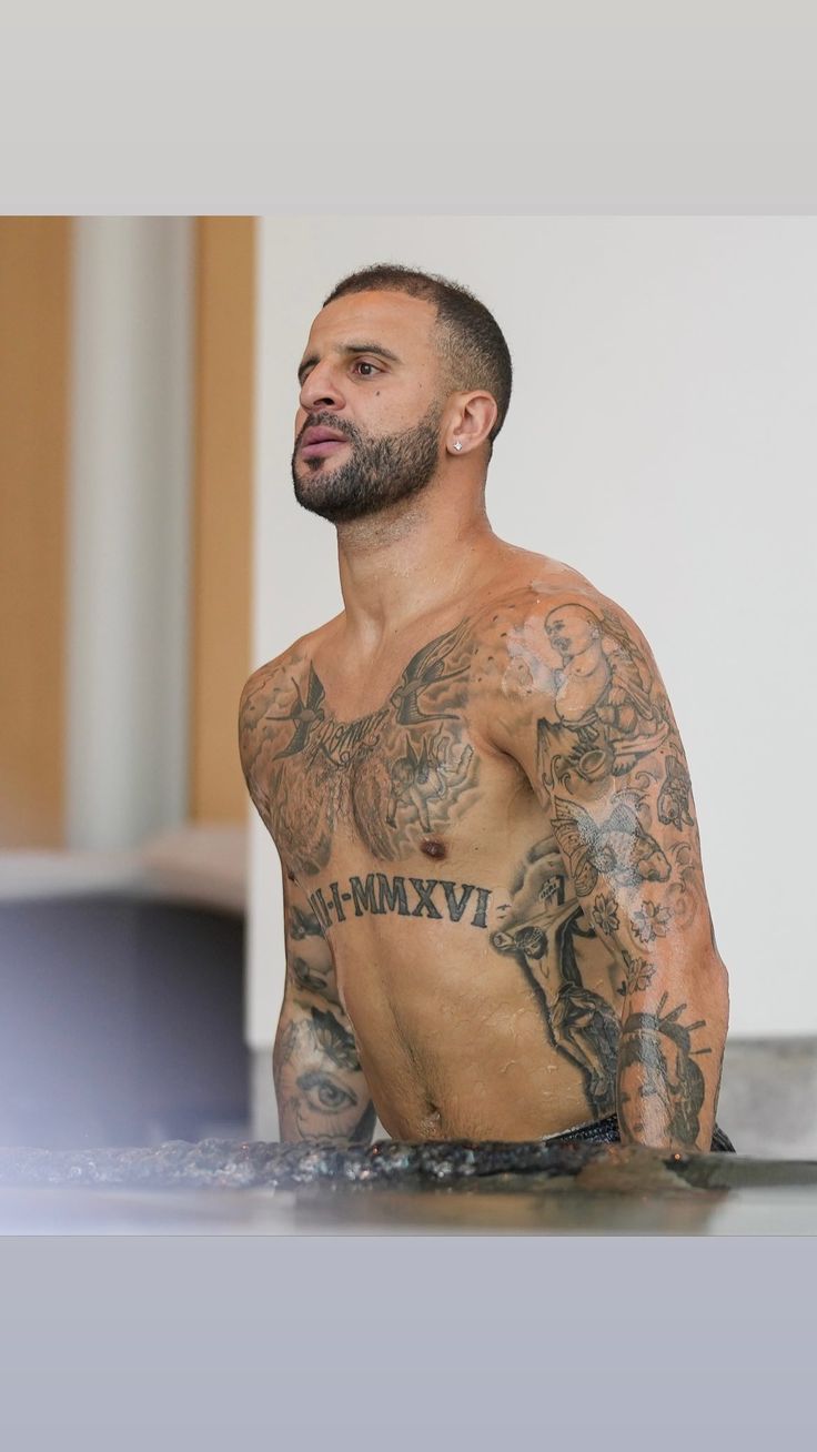 Kyle Walker Roman numeral family date tattoo across his torso