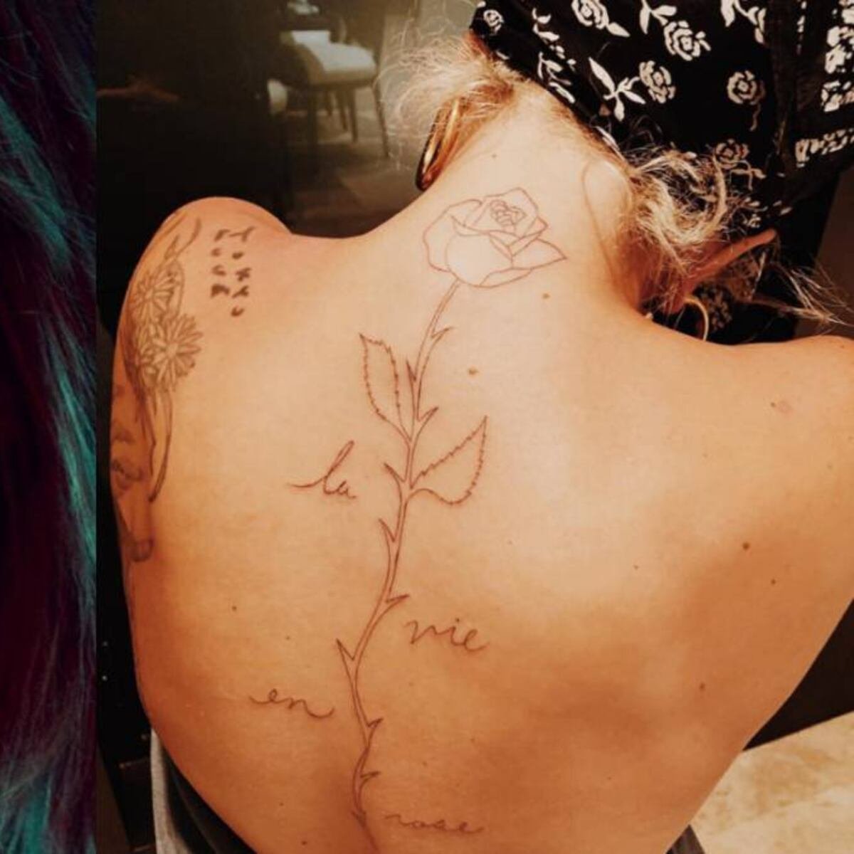 Lady Gaga's musical staff tattoo spelling GAGA on her back