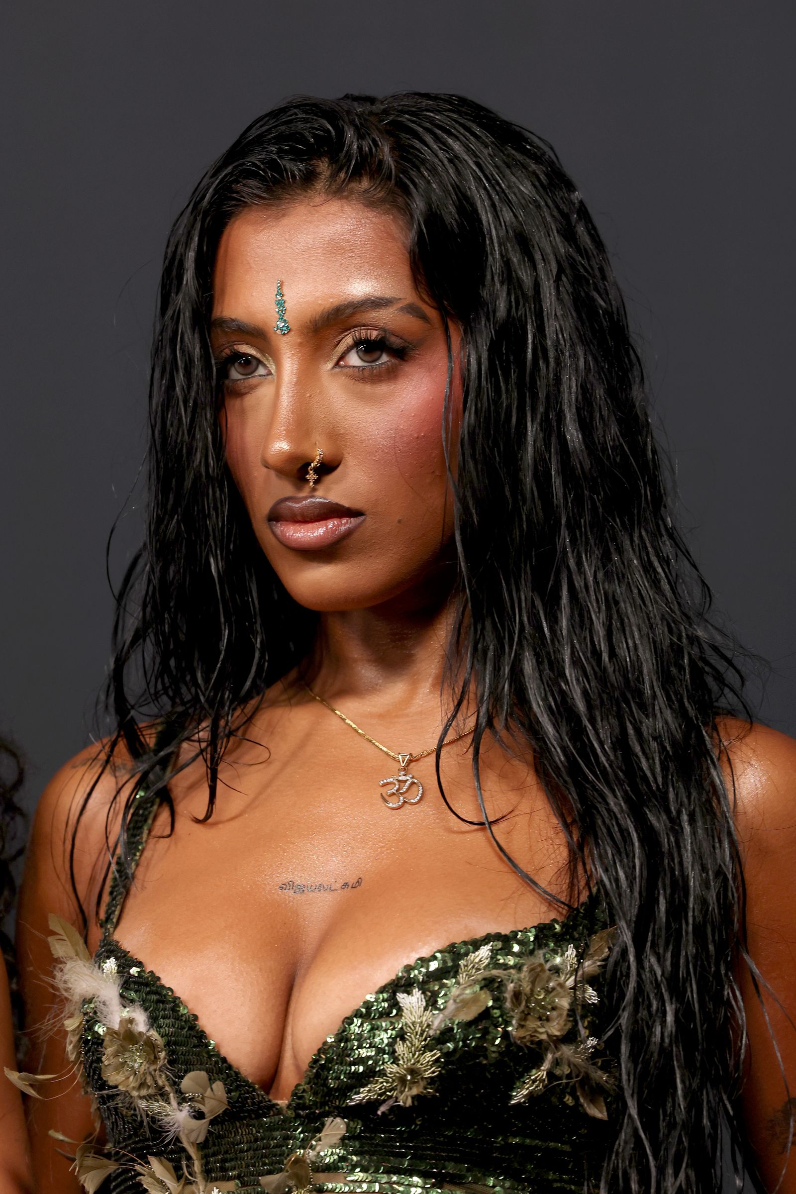 KATSEYE Lara Raj Tamil chest tattoo and face portrait