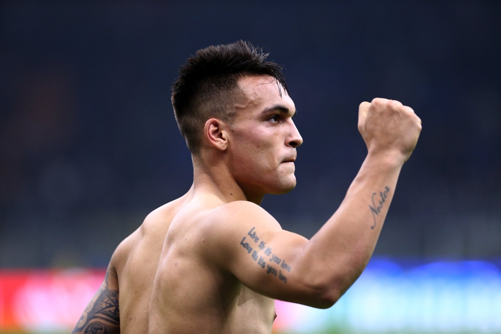 Lautaro Martínez lion and cub back tattoo after a match