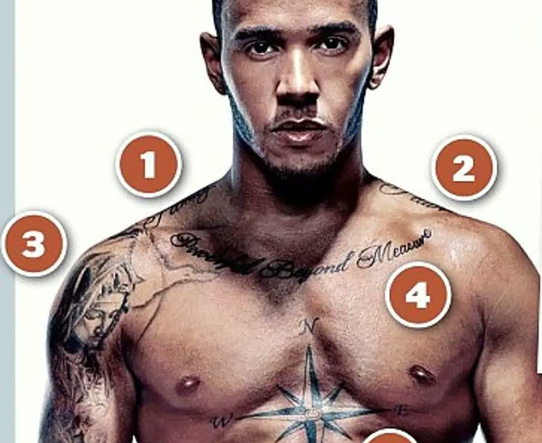 Lewis Hamilton showing the Family and Faith shoulder lettering and chest tattoos.