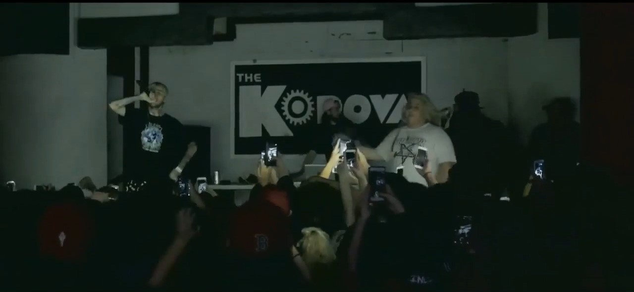 Lil Peep showing his family and face tattoos