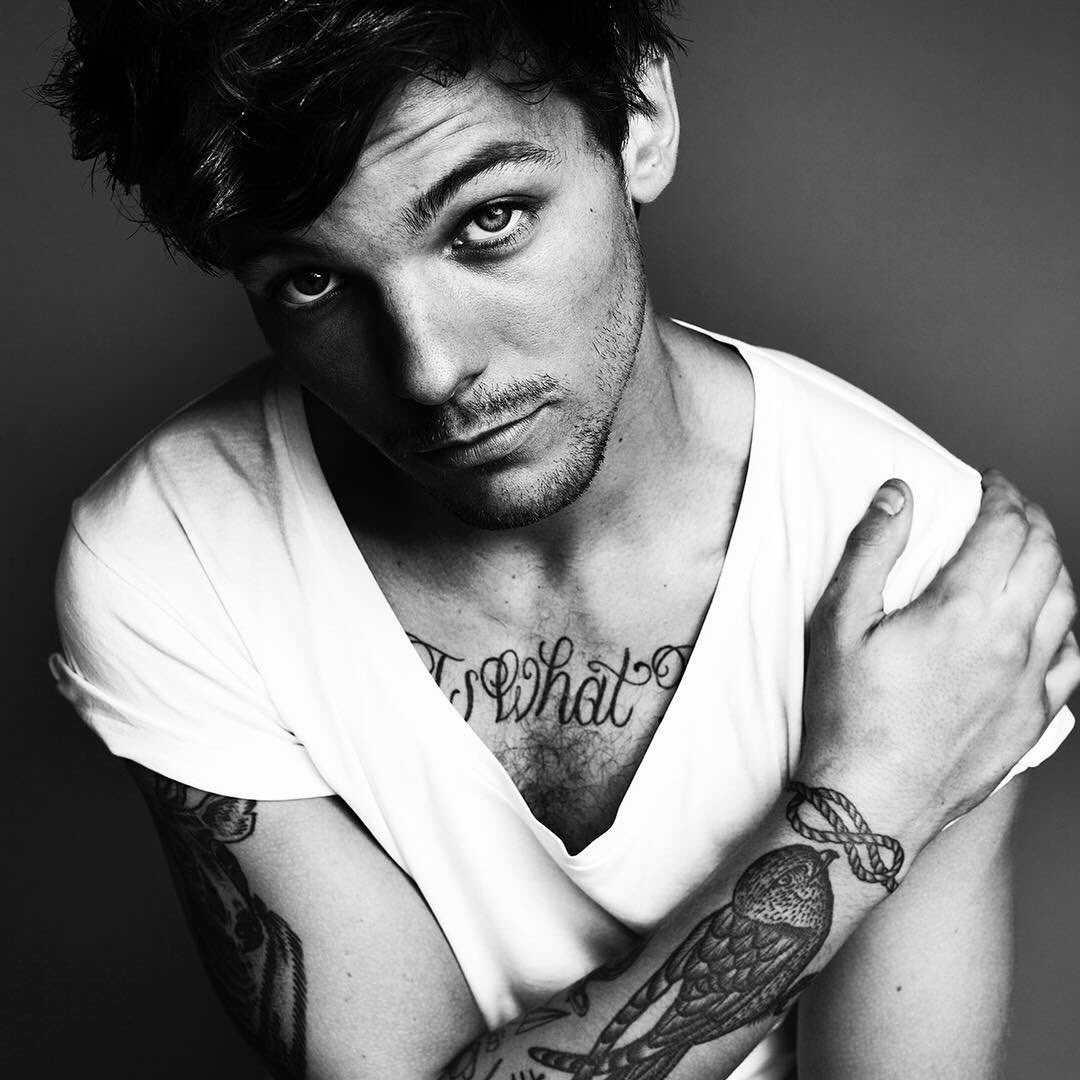 Louis Tomlinson chest quote tattoo