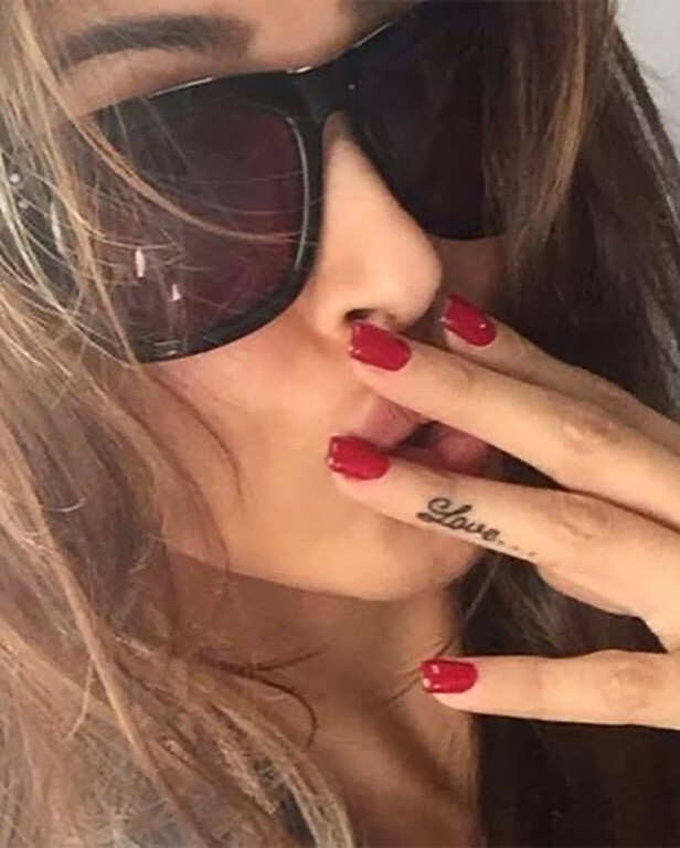 Malaika Arora name and wings tattoo